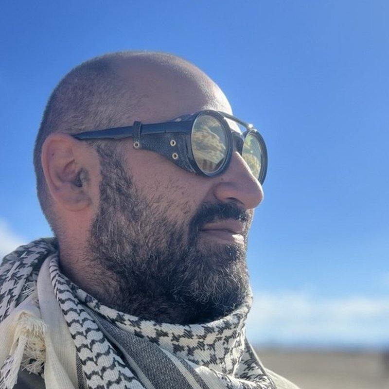 Robert Melkonian on the playa in goggles and a scarf